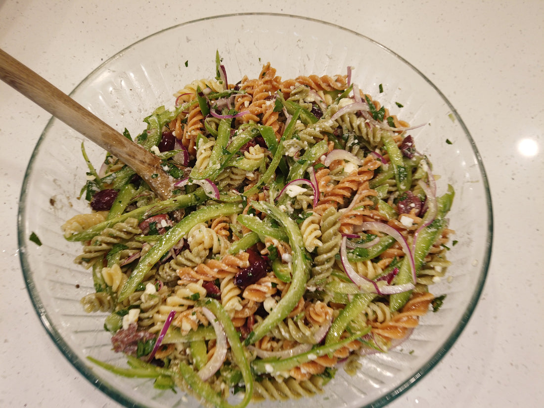 delicious greek inspired vegetarian pasta salad. Easy to make and bursting with flavor!